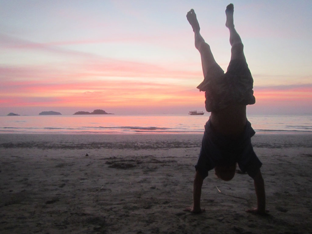 Andrei doing a sunset handstand on Klong Prao beach